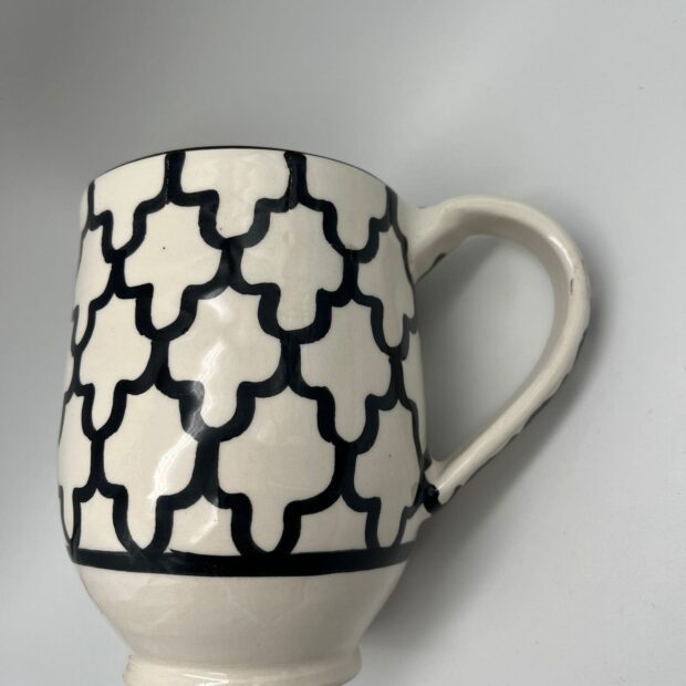 Hand-Painted Mug with Intricate Black Patterns